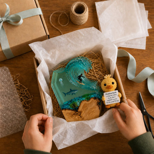 Order being packed carefully with tissue paper and ribbon